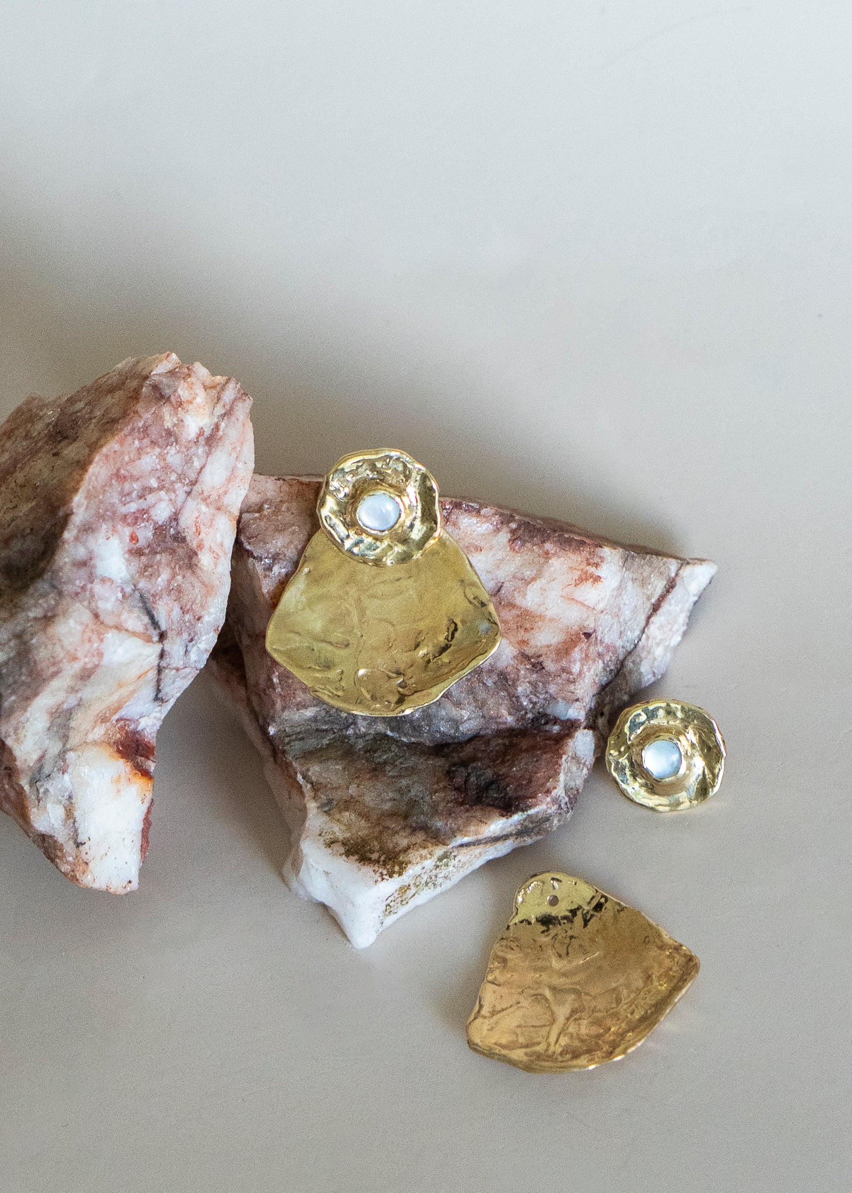 Ora studs and Slice Jackets Brass